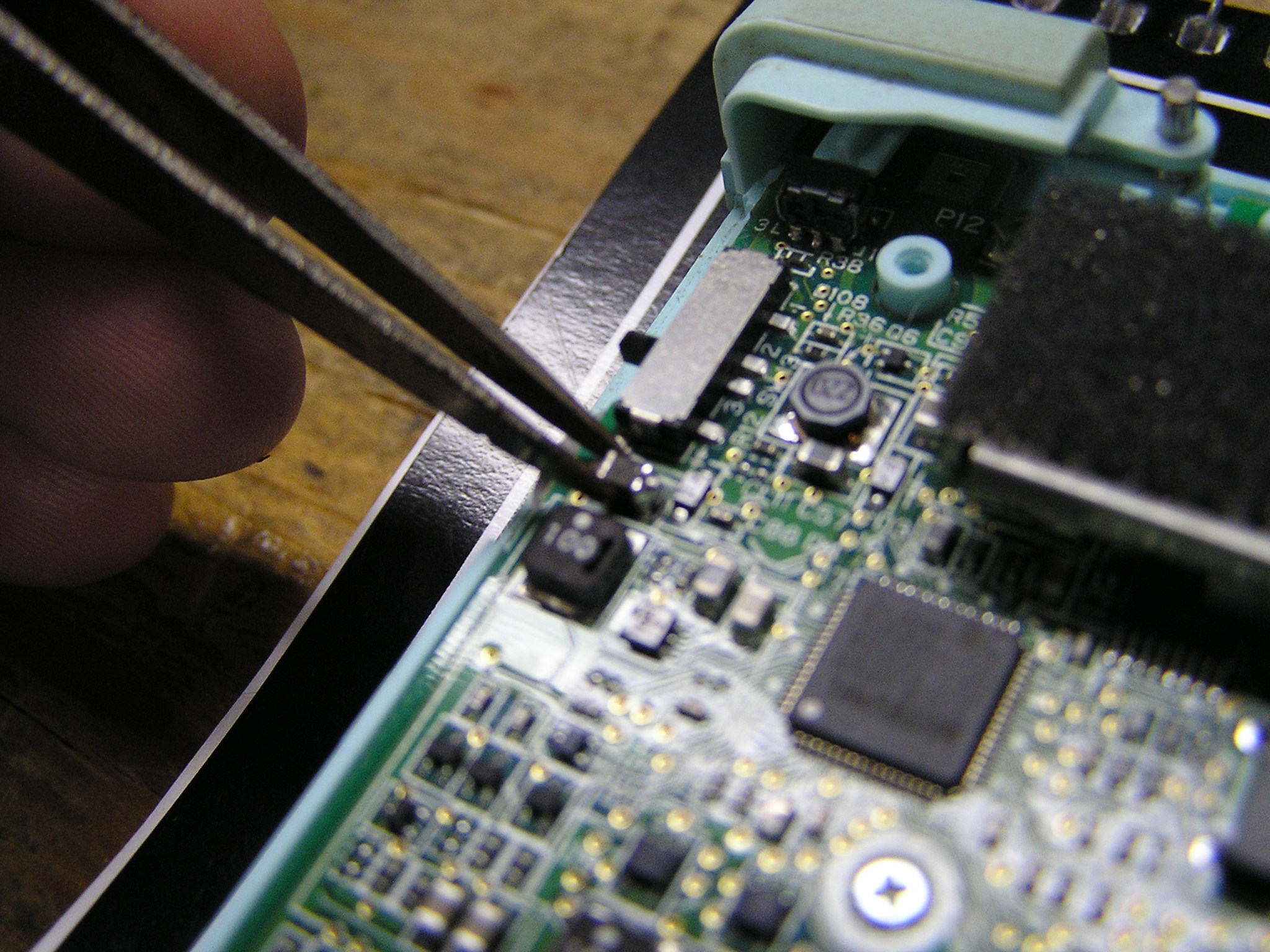 Re-solder part back onto motherboard