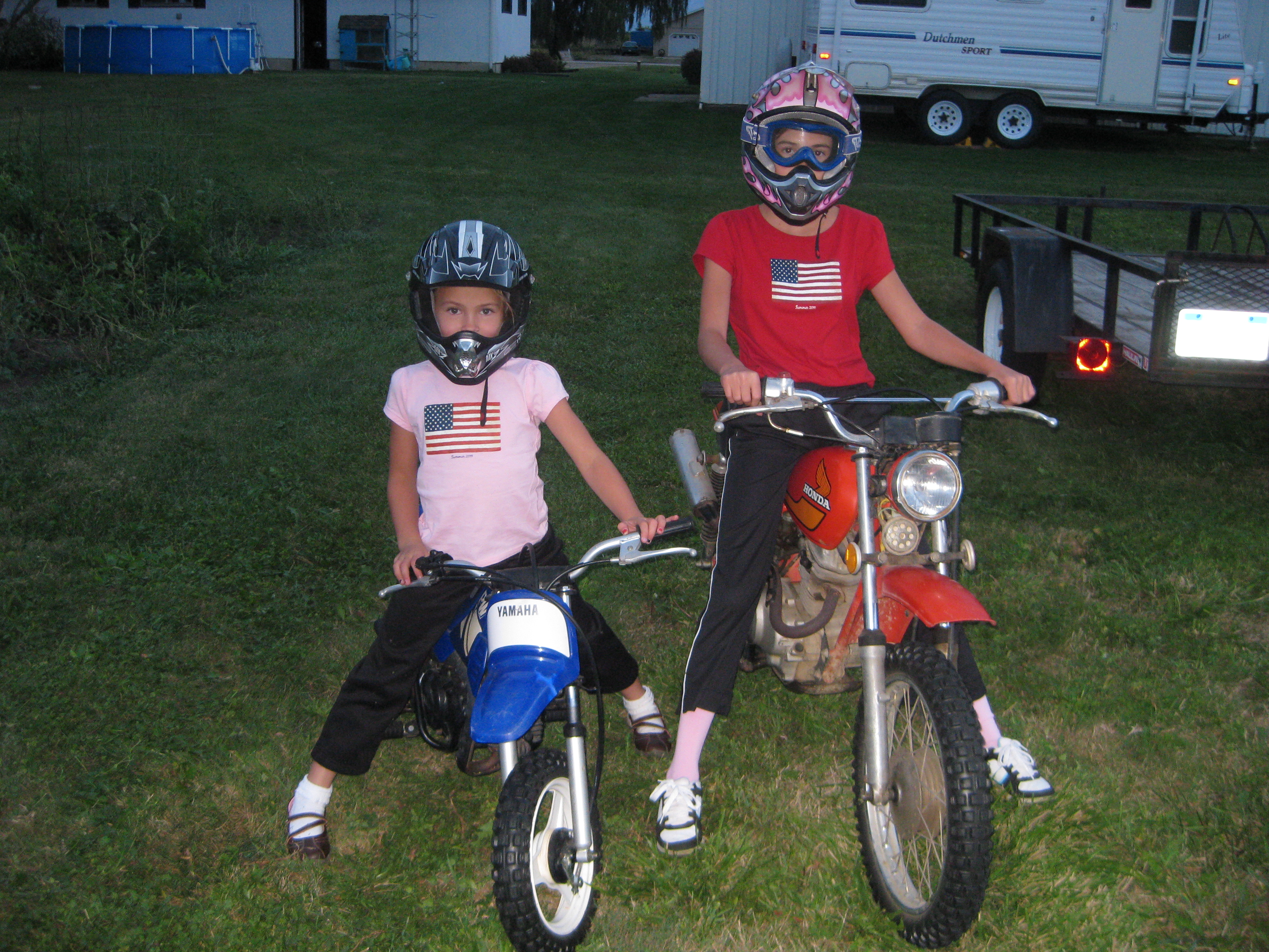 Both my girls riding dirt bikes in the back yard. 2012